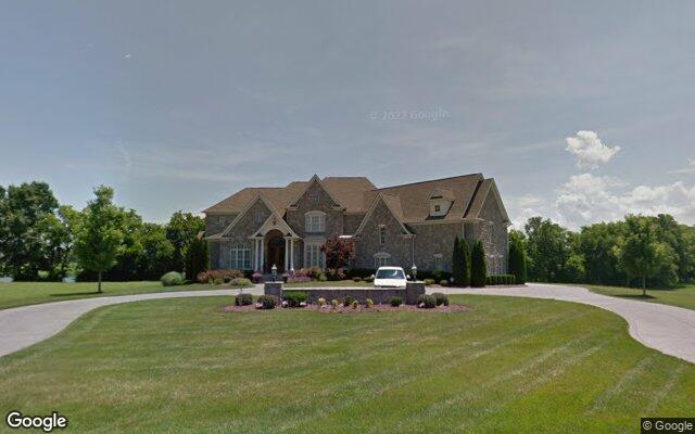 An estate home on the golf course side of Fairvue